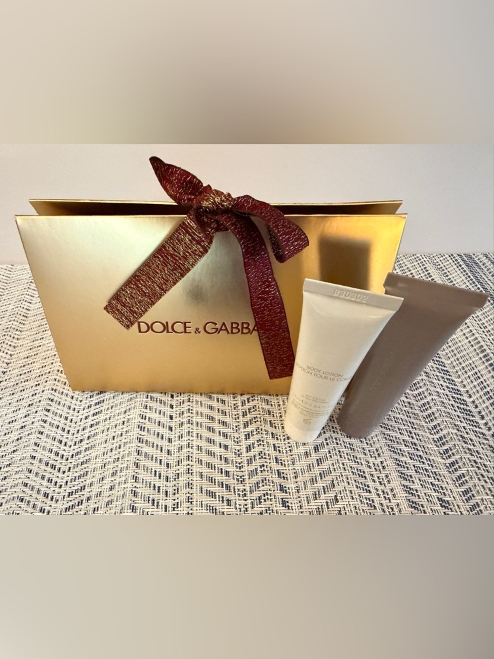 Dolce & Gabbana Gold Bag with Burgundy Ribbon and Devotion Lotion and Body Wash